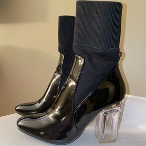 Black leather booties with clear heel